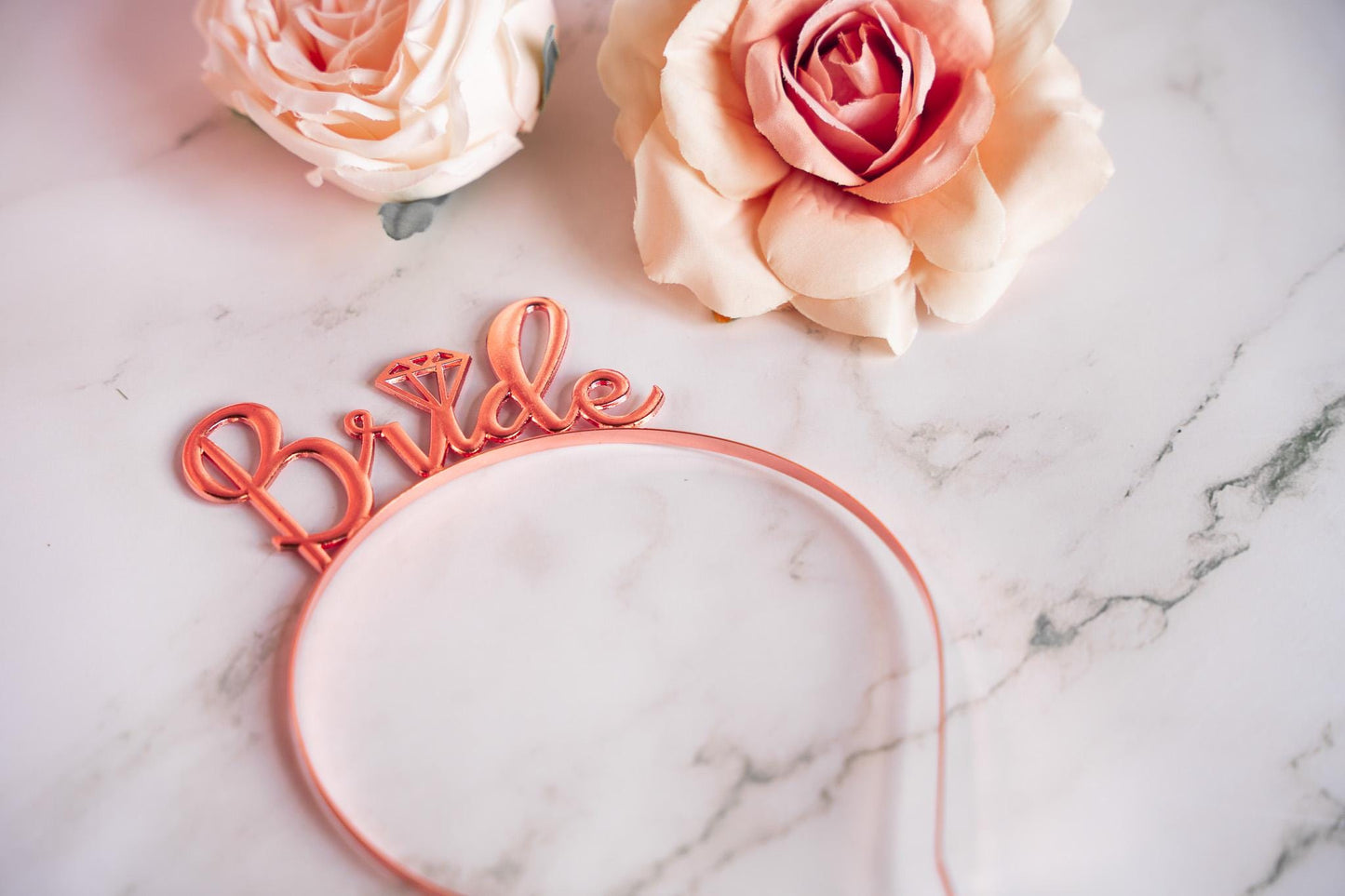 a rose and a rose headband with the word love on it
